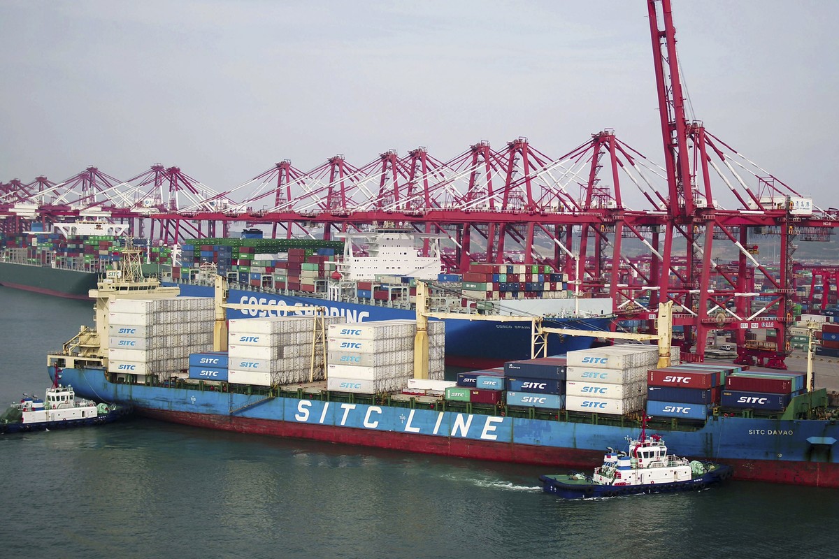 Two barges push a container ship to the dockyard in Qingdao in eastern China's Shandong province Wednesday, May 8, 2019. China's exports fell unexpectedly in April, adding to pressure on Bei ...