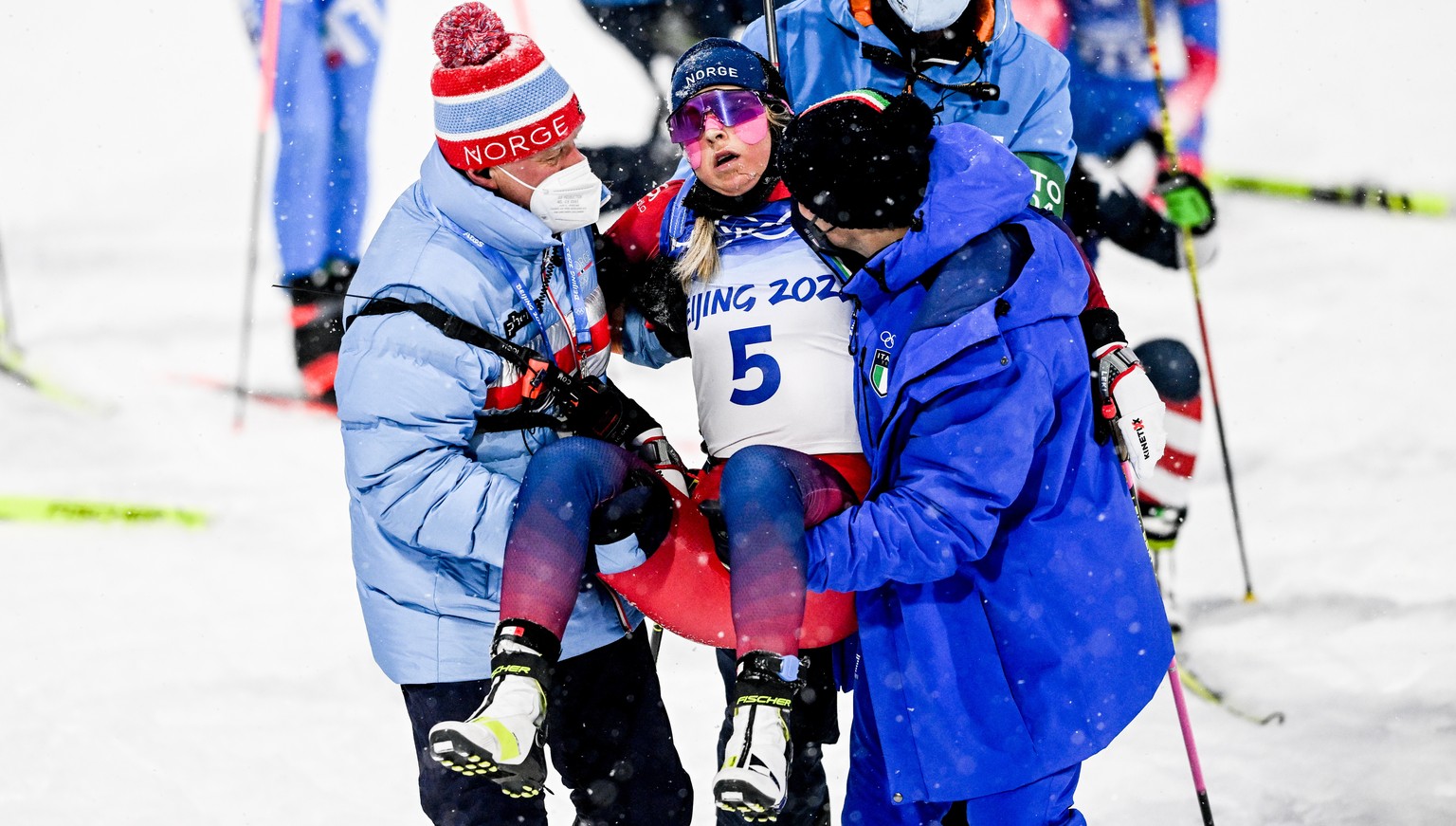 epa09752020 Ingrid Landmark Tandrevold of Norway reacts during the Women&#039;s Biathlon 10km Pursuit race at the Zhangjiakou National Biathlon Centre at the Beijing 2022 Olympic Games, Zhangjiakou, C ...