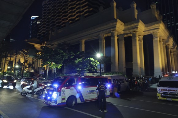 An ambulance sits outside the Grand Hyatt Erawan Hotel to Chulalongkorn hospital in Bangkok, Thailand, Tuesday, July 16, 2024. Police say the bodies of six people were found in the luxury hotel in dow ...