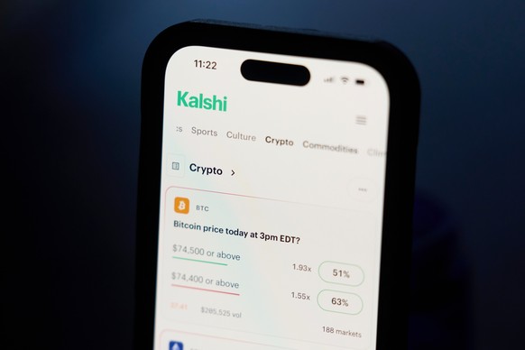 A phone displays crypto trades on Kalshi on Thursday, April 16, 2026, in Portland, Ore. (AP Photo/Jenny Kane)
Prediction Markets Polymarket