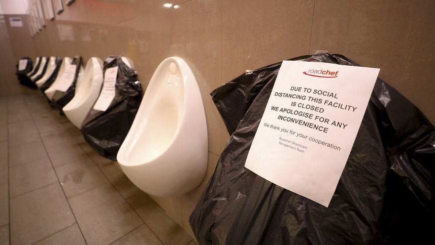 The men's toilet facilities at the Strensham Services on the M5 Motorway in Worcestershire, England, where alternate urinals are out of use to maintain social distancing as the UK continues in lo ...
