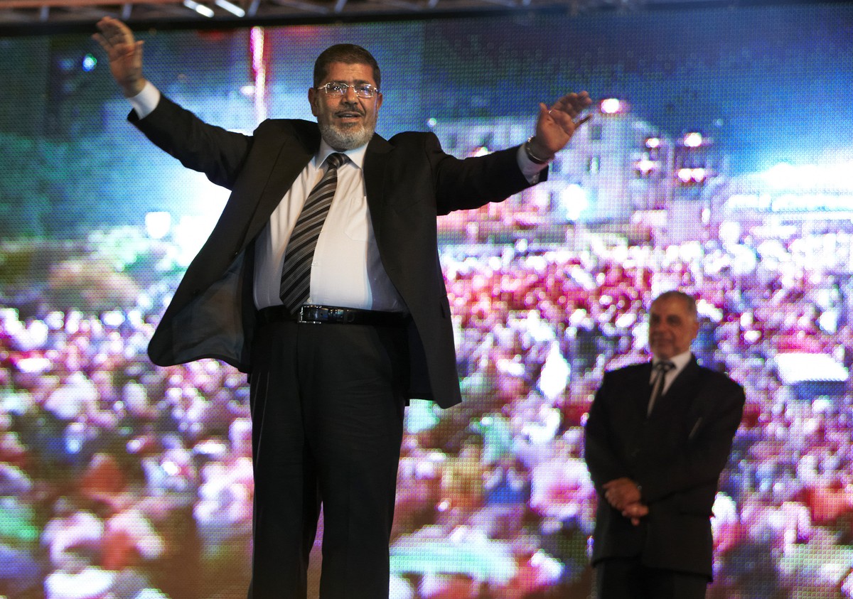 FILE - In this May 20, 2012 file photo, then Muslim Brotherhood's presidential candidate Mohammed Morsi holds a rally in Cairo, Egypt. On Monday June 17, 2019, Egypt's state TV says the coun ...