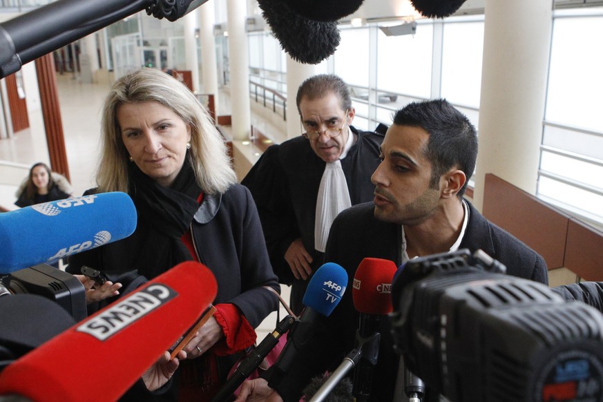 Lawyers for the suspect Marc Goudarzian and Sandrine Parise-Heideiger, left, answer reporters at the hall of justice Tuesday, Feb.13, 2018 in Pontoise, outside Paris. A 29-year-old man is set to appea ...