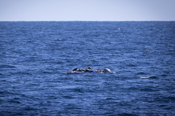 An empty rubber boat is seen after a rescue operation by volunteers of the Ocean Viking rescue ship, run by NGOs SOS Mediterranee and the International Federation of Red Cross (IFCR), Thursday,