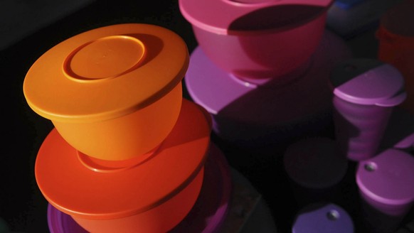 This Friday, Aug. 5, 2011 photo shows some of Kevin Farrell&#039;s colorful Tupperware products at a Tupperware party in Bellflower, Calif. Tupperware, it seems, is enjoying a renaissance 65 years aft ...