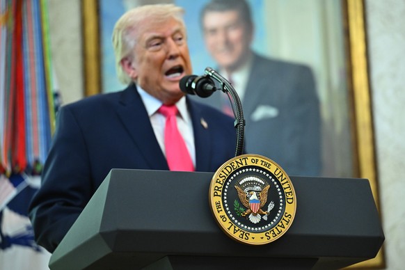 epa12847033 The seal of the President of the United States as US President Donald Trump speaks during a swearing-in ceremony in the Oval Office of the White House in Washington, DC, USA, 24 March 2026 ...