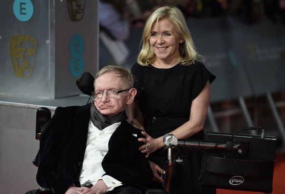 epa06602121 (FILE) - British scientist Stephen Hawking (L) and his daughter Lucy Hawking (R) arrive on the red carpet for the 2015 British Academy Film Awards ceremony at The Royal Opera House in Lond ...