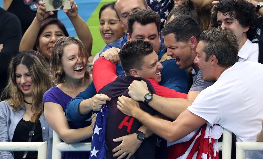 epa05479300 Gold medalist Anthony Ervin of USA (C) reacts in the stands during the round of honour after the medal ceremony for the men&#039;s 50m Freestyle Final race of the Rio 2016 Olympic Games Sw ...