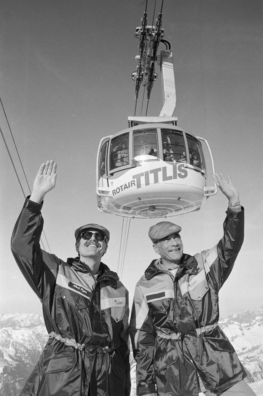 Albert Wyler, left, and Eugenio Rueegger, the directors of the Titlisbahnen at the opening of the Rotair-Titlisbahn near Engelberg in the canton of Obwalden, the first revolving mountain railway between Stand and ...