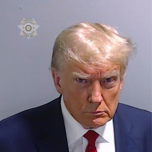 This booking photo provided by the Fulton County Sheriff?s Office shows former President Donald Trump on Thursday, Aug. 24, 2023, after he surrendered and was booked at the Fulton County Jail in Atlan ...