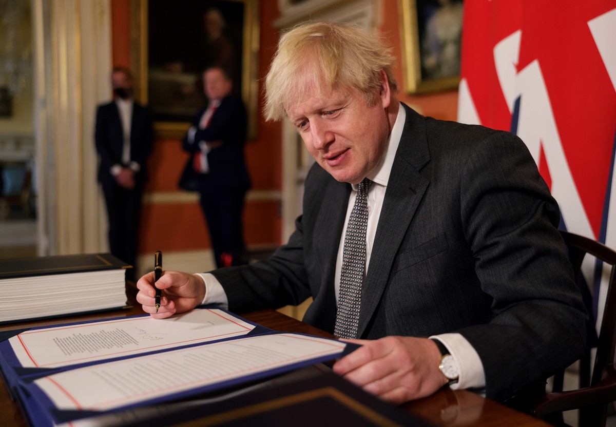 epa08911632 A handout photo made available by n10 Downing street shows Britain's Prime Minister Boris Johnson after signing the Trade and Cooperation Agreement between the UK and the EU, the Brex ...