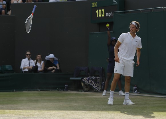 Austria&#039;s Dominic Thiem bounces his racket on the court as he plays Czech Republic&#039;s Tomas Berdych during their Men&#039;s Singles Match on day seven at the Wimbledon Tennis Championships in ...