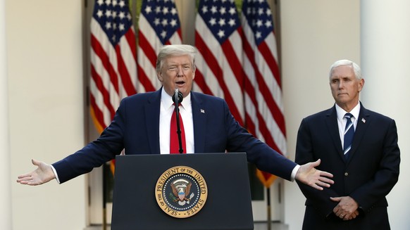 President Donald Trump speaks about the coronavirus in the Rose Garden of the White House, Monday, April 27, 2020, in Washington, as Vice President Mike Pence listens. (AP Photo/Alex Brandon)
Donald T ...