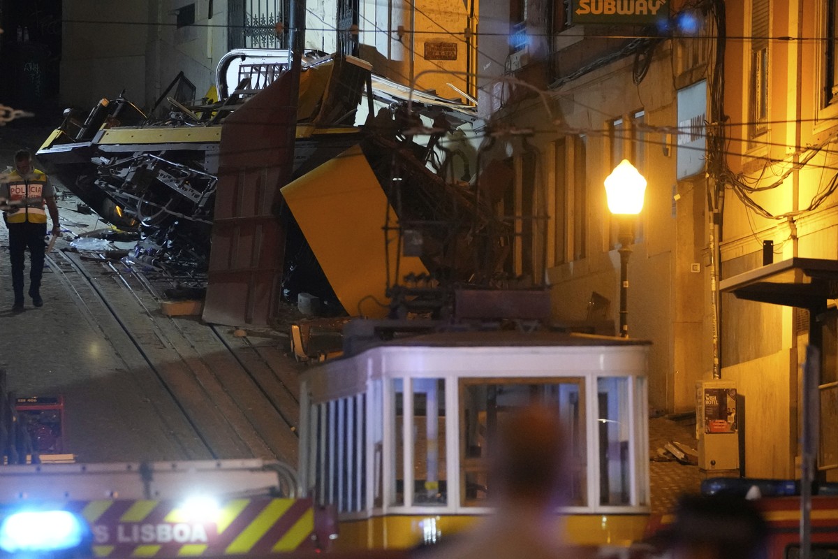 A police officer walks at the site of a derailed electric streetcar in Lisbon, Portugal, Wednesday, Sept. 3, 2025. (AP Photo/Armando Franca)
Portugal Streetcar Derailed