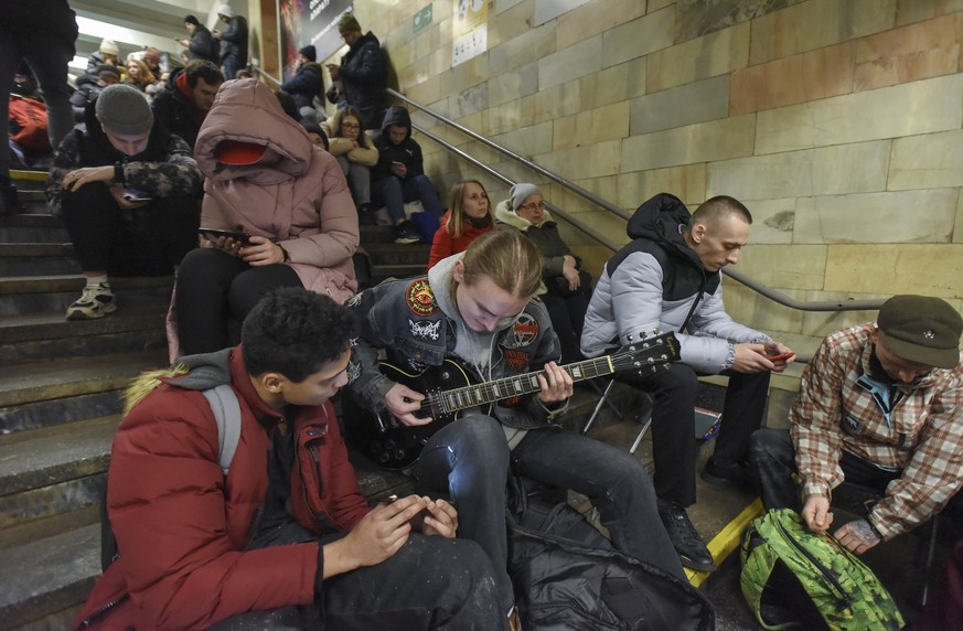 epa10383742 Residents take shelter inside a metro station during an air raid alert in Kyiv (Kiev), Ukraine, 31 December 2022. Russian missiles targeted major cities across Ukraine on 31 December prior ...