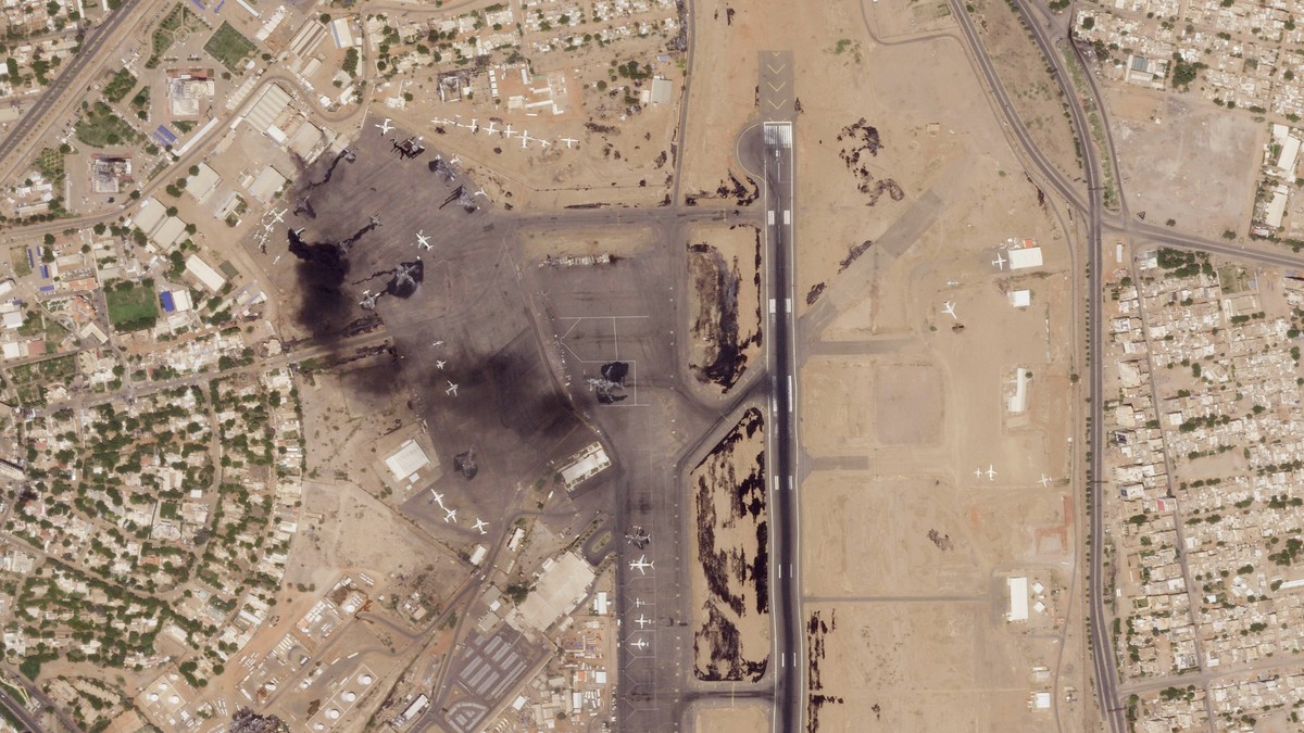 This satellite photo from Planet Labs PBC shows damaged aircraft, including one on fire, at Khartoum International Airport in Khartoum, Sudan, Monday, April 17, 2023. Satellite images from Planet Labs ...