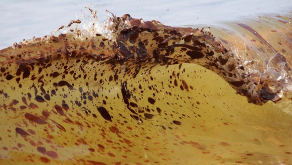 FILE - In this file photo taken June 12, 2010, crude oil from the Deepwater Horizon oil spill washes ashore in Orange Beach, Ala. The spring of coronavirus feels a lot like the summer of oil to reside ...