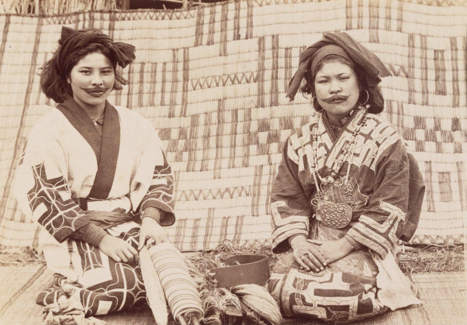 Two Ainu women with lip tattoos. Japan, 1890. Photo by Tamoto Kenzō.