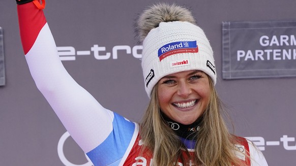 The winner Switzerland&#039;s Corinne Suter celebrates after an alpine ski, women&#039;s World Cup downhill in Garmisch-Partenkirchen, Germany, Saturday, Jan. 29, 2022. (AP Photo/Pier Marco Tacca)