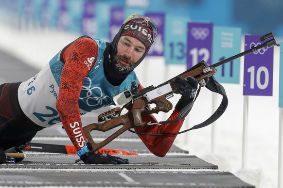 Benjamin Weger, of Switzerland, gets up from the prone shooting position during the men&#039;s 10-kilometer biathlon sprint at the 2018 Winter Olympics in Pyeongchang, South Korea, Sunday, Feb. 11, 20 ...