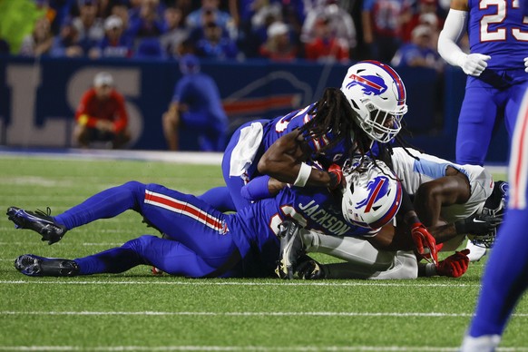 Buffalo Bills cornerback Dane Jackson, bottom, is injured on a play during the first half of an NFL football game against the Tennessee Titans, Monday, Sept. 19, 2022, in Orchard Park, N.Y. (AP Photo/ ...