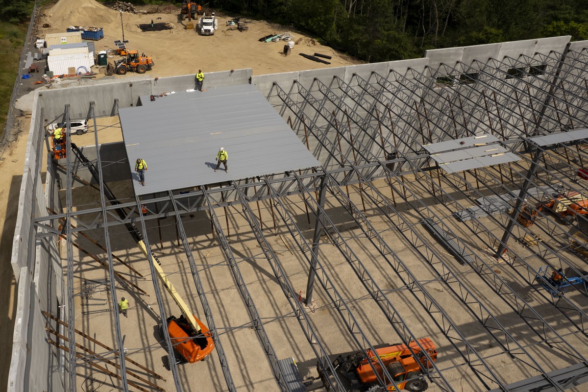 epa12192860 Construction crews work on a large building site using steel and concrete in Chelmsford, Massachusetts, USA, 23 June 2025. US President Donald Trump recently increased steel tariffs to 50% ...