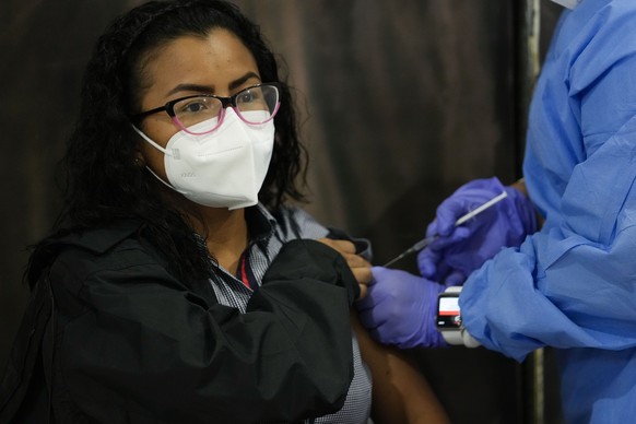 Kiara Morales, 31, gets a shot of the AstraZeneca vaccine for COVID-19 at the Mega Mall on the outskirts of Panama City, Wednesday, June 9, 2021. On Wednesday, Panama began vaccinating women age 30 an ...