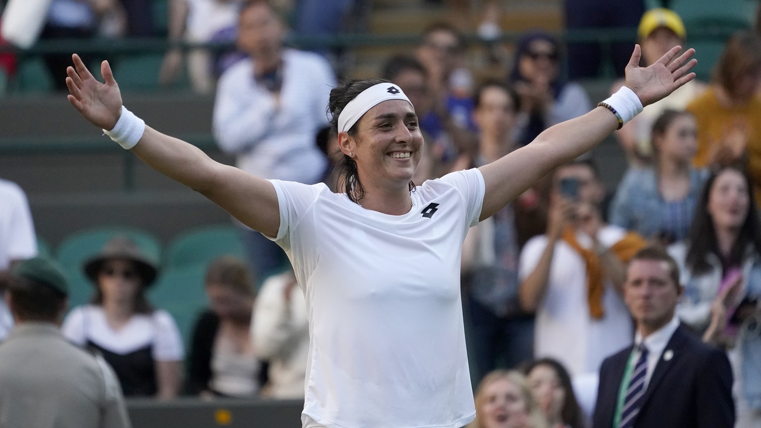 Tunisia&#039;s Ons Jabeur celebrates defeating Belgium&#039;s Elise Mertens during a fourth round women&#039;s singles match on day seven of the Wimbledon tennis championships in London, Sunday, July  ...