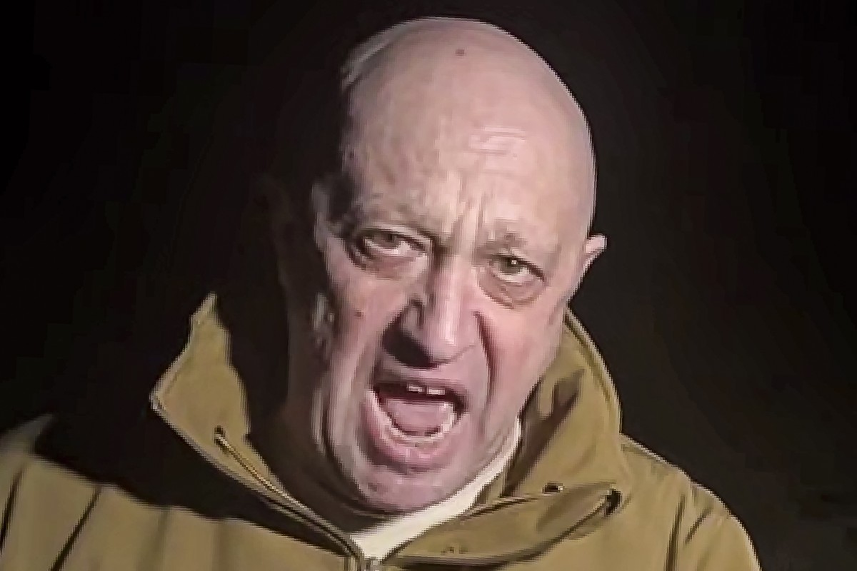 FILE - In this handout image taken from a video released by Prigozhin Press Service on Friday, May 5, 2023, head of Wagner Group Yevgeny Prigozhin stands in front of multiple bodies lying on the groun ...