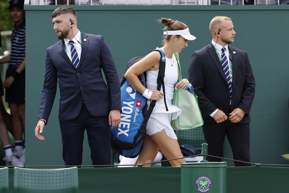 Belinda Bencic of Switzerland leaves the court after losing her first round match against Qiang Wang of China, at the All England Lawn Tennis Championships in Wimbledon, London, Tuesday, June 28, 2022 ...