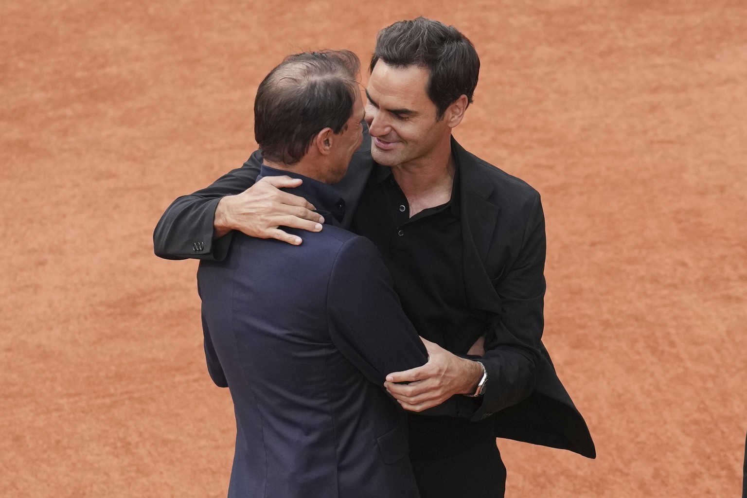 Rafa Nadal, left, hugs Roger Federer, during a farewell ceremony at center court Philippe-Chatrier, at the Roland-Garros stadium, in Paris, Sunday May 25, 2025. (AP Photo/Christophe Ena)
French Open N ...