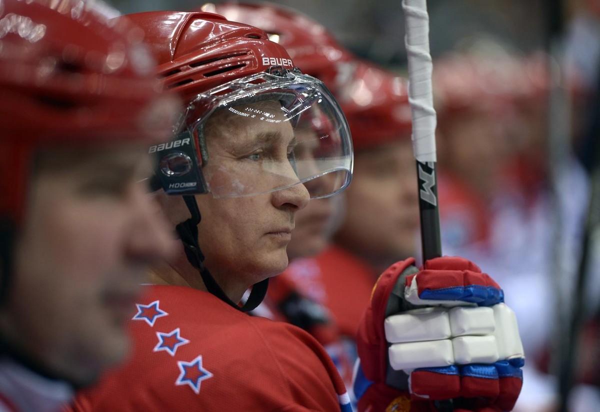 Russian President Vladimir Putin watches an exhibition hockey game at a tournament of the Night Hockey League in the Black Sea resort of Sochi, Russia, Saturday, May 16, 2015. President Vladimir Putin ...
