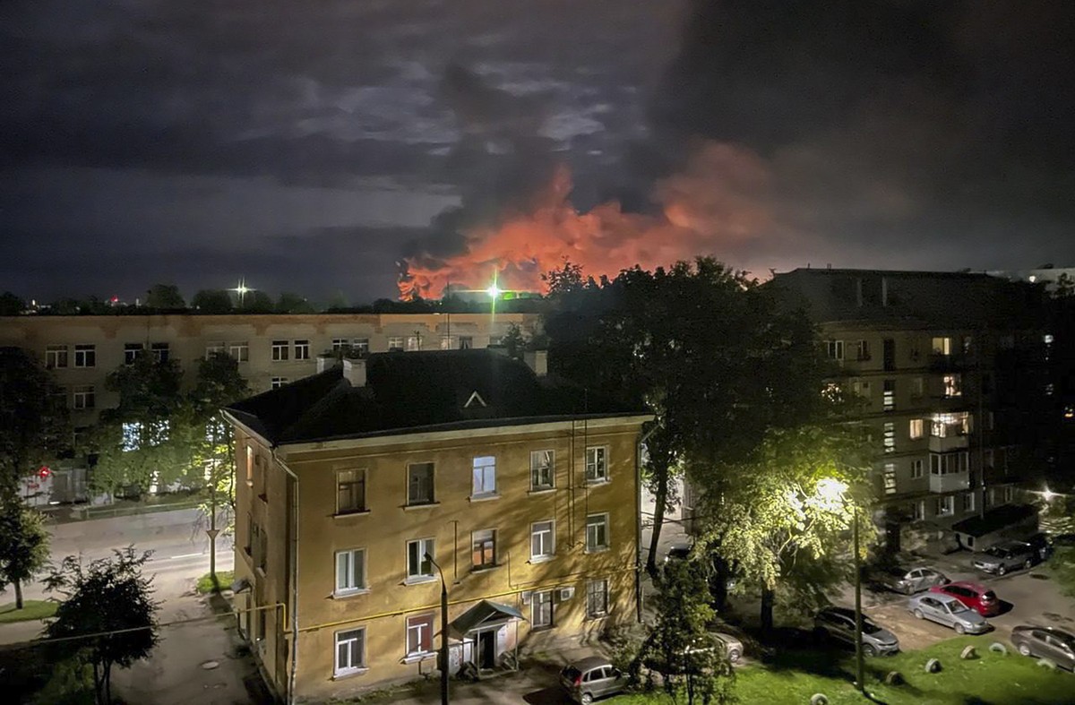 epa10827977 A handout photo made available by the Governor of Russian Pskov region Mikhail Vedernikov Telegram channel shows smoke billowing and explosions light after Russian militaries destroyed dro ...