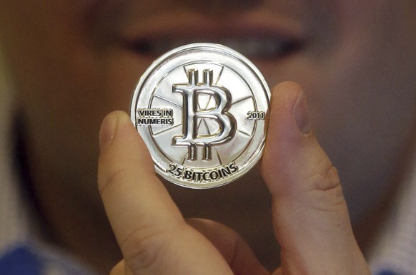 FILE - In this April 3, 2013 photo, a 25 Bitcoin token is displayed in Sandy, Utah. (AP Photo/Rick Bowmer, File)
Trump Crypto