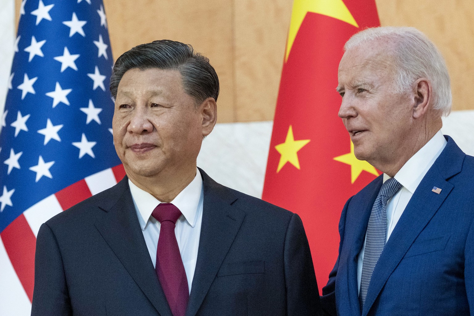 FILE - President Joe Biden, right, stands with Chinese President Xi Jinping before a meeting on the sidelines of the G20 summit meeting, Nov. 14, 2022, in Bali, Indonesia. Ahead of an expected meeting ...