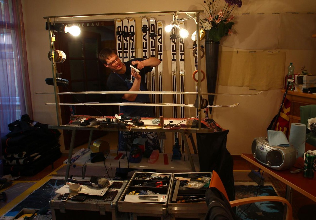 Ski serviceman Chris Krause, of the United States, who normally works behind the scenes, gets a chance to stand in front of the cameras inside the ski workroom in Schladming, Austria, Friday, March 16 ...