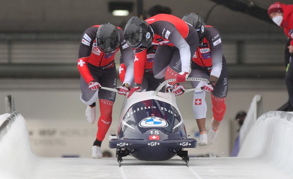 epa09638566 Simon Friedli, Adrian Faessler, Gregory Jones and Andreas Haas of Switzerland in action during the first run of the four-man competition at the IBSF Skeleton and Bobsleigh World Cup in Win ...