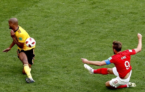 epa06888259 Harry Kane of England (R) and Vincent Kompany of Belgium in action during the FIFA World Cup 2018 third place soccer match between Belgium and England in St.Petersburg, Russia, 14 July 201 ...