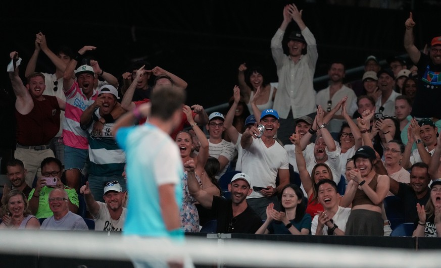 Spectators cheer Stan Wawrinka of Switzerland during his third round match against Taylor Fritz of the U.S. at the Australian Open tennis championship in Melbourne, Australia, Saturday, Jan. 24, 2026. ...