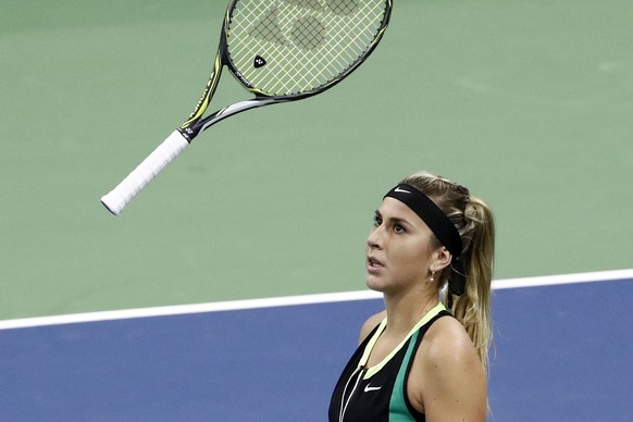 Belinda Bencic of Switzerland throws her racket during her first round match against Carina Witthoeft of Germany, at the WTA Ladies Open tennis tournament in Biel, Switzerland, Tuesday, April 11, 2017 ...