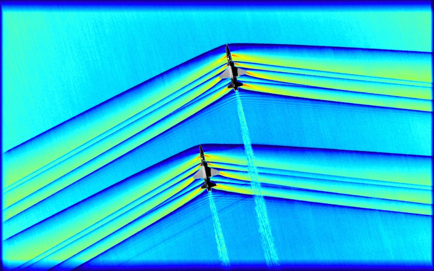 epa07421024 An undated handout photo made available by NASA photo shows two T-38 aircrafts in supersonic speed with shockwaves around them, at NASA’s Armstrong Flight Research Center in Edwards, Calif ...