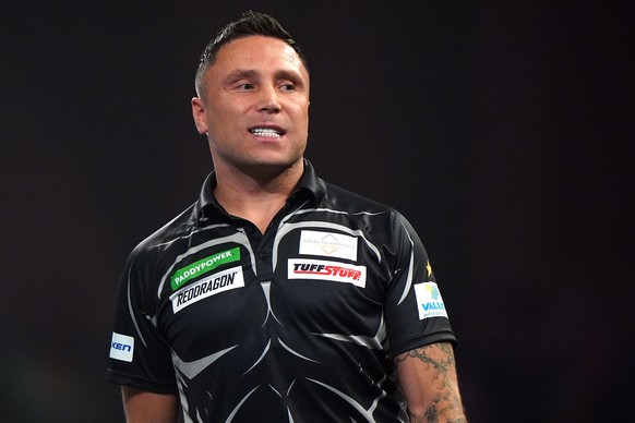 Wales' Gerwyn Price reacts during his Round 2 match against Netherlands' Wesley Plaisier, not pictured, on day eleven of the Paddy Power World Darts Championship in London, Sunday Dec. 21, 2 ...