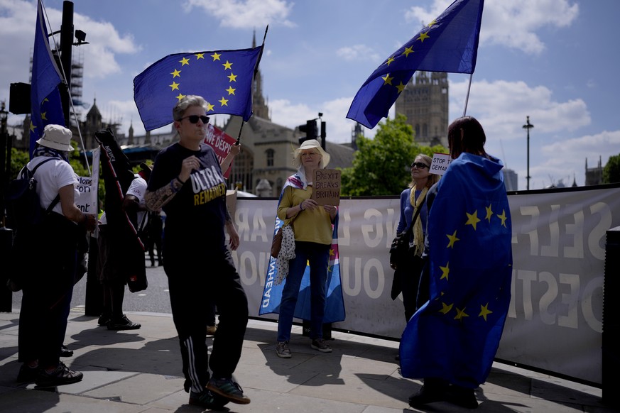 Supporters of Britain remaining in the European Union protest against Brexit on the edge of Parliament Square in London, Wednesday, June 23, 2021. Five years ago today, Britons voted in a referendum t ...