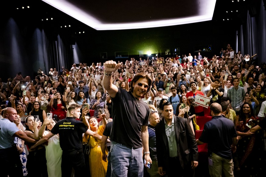 Indian actor Shah Rukh Khan, reacts with the fans during a conversation with the audience at the 77th Locarno International Film Festival, in Locarno, Switzerland, Sunday, August 11, 2024. (KEYSTONE/J ...