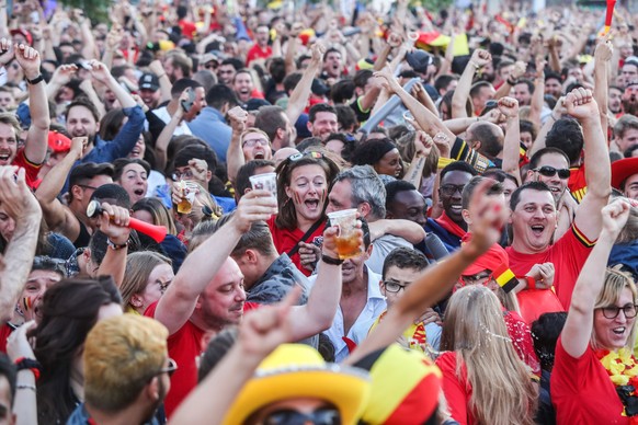 epa06859442 Belgian soccer fans celebrate their team scoring while watching the FIFA World Cup 2018 Round of 16 match between Belgium and Japan, in Jette, a Brussels municipality, Belgium, 02 July 201 ...