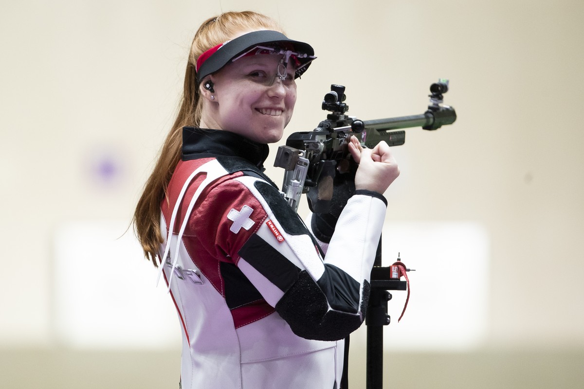Nina Christen of Switzerland reacts after winning the gold medal in the women's shooting 50m Rifle 3 Positions Finals at the 2020 Tokyo Summer Olympics in Tokyo, Japan, on Saturday, July 31, 2021 ...