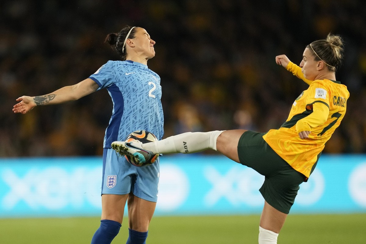 Australia's Steph Catley, right, and England's Lucy Bronze challenge for the ball during the Women's World Cup semifinal soccer match between Australia and England at Stadium Australia  ...