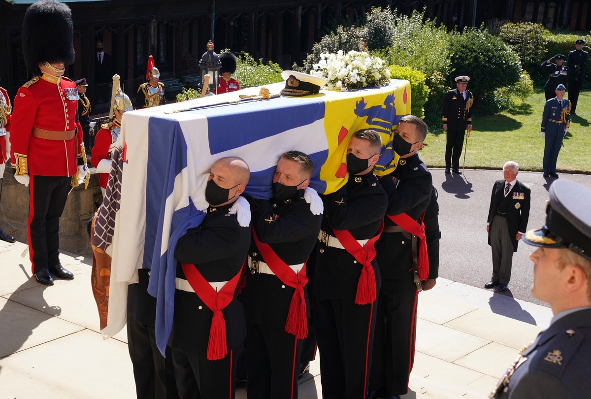 The coffin is held on the steps of St George's Chapel during the procession of Britain Prince Philip's funeral at Windsor Castle, Windsor, England, Saturday April 17, 2021. Prince Philip die ...