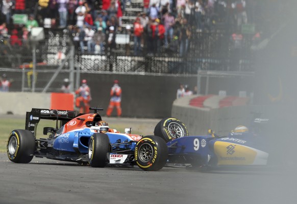 Manor Racing driver Pascal Wehrlein, of Germany, left, and Sauber driver Marcus Ericsson, of Sweden, spin out after crashing at the start of the Formula One Mexico Grand Prix auto race at the Hermanos ...