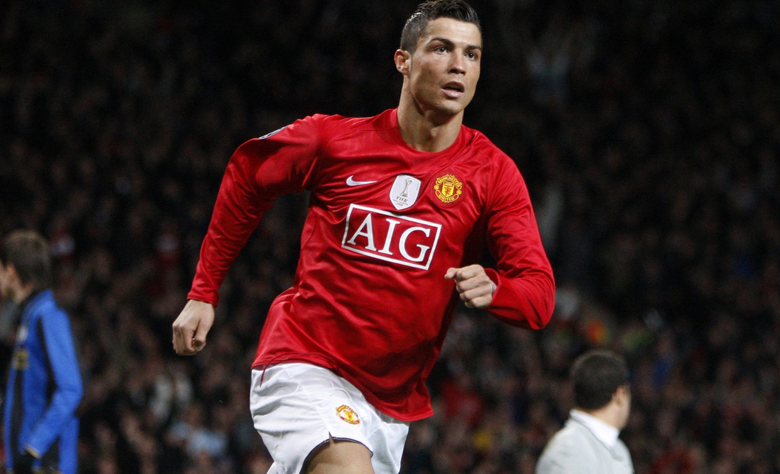 Manchester United&#039;s Cristiano Ronaldo, center, celebrates after scoring against Inter Milan during their Champions League Second Round Second Leg soccer match at Old Trafford Stadium, Manchester, ...